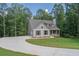 Gray siding house with a large yard and circular driveway at 939 Jean Ct, Covington, GA 30014