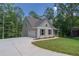 House with gray siding, dark shutters, and a large yard at 939 Jean Ct, Covington, GA 30014