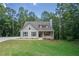 Craftsman style home with gray siding, landscaping, and driveway at 939 Jean Ct, Covington, GA 30014