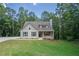 Charming one-story house with gray siding, a large yard, and a tree-lined backdrop at 939 Jean Ct, Covington, GA 30014