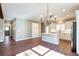 Bright kitchen with an island, white cabinets, and a chandelier at 939 Jean Ct, Covington, GA 30014