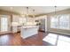 Modern kitchen with white shaker cabinets, quartz countertops, and stainless steel appliances at 939 Jean Ct, Covington, GA 30014