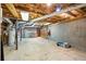 Unfinished basement with concrete floor, exposed ceiling, garage door and walls, ready for customization at 978 W Mill Bnd, Kennesaw, GA 30152