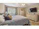 A comfortable bedroom featuring neutral decor, carpet flooring, and a large window at 978 W Mill Bnd, Kennesaw, GA 30152