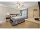 A spacious bedroom with neutral tones, plush carpeting, and natural light streaming through the window at 978 W Mill Bnd, Kennesaw, GA 30152