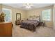Bedroom with cozy carpeting, light-filled windows, and comfortable decor at 978 W Mill Bnd, Kennesaw, GA 30152