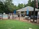 Community pool area with lounge chairs, umbrellas, and seating areas at 978 W Mill Bnd, Kennesaw, GA 30152