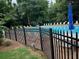 Community pool surrounded by sun loungers and trees for shade at 978 W Mill Bnd, Kennesaw, GA 30152