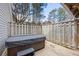 Private outdoor deck featuring a hot tub with wooden fence surround, offering relaxation and entertainment space at 978 W Mill Bnd, Kennesaw, GA 30152