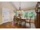 Dining area with wood floors, chandelier, and large windows overlooking the yard at 978 W Mill Bnd, Kennesaw, GA 30152