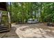 RV parked on driveway surrounded by lush greenery and trees at 978 W Mill Bnd, Kennesaw, GA 30152