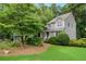 A home's well-manicured lawn and lush landscaping complement its attractive exterior at 978 W Mill Bnd, Kennesaw, GA 30152