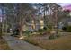 Beautiful home with meticulously landscaped front yard and mature trees, showcasing its curb appeal at 978 W Mill Bnd, Kennesaw, GA 30152