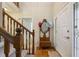 Inviting foyer features a staircase, coat rack, and a stylish front door at 978 W Mill Bnd, Kennesaw, GA 30152