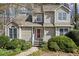 Charming two-story home with a well-maintained front yard, featuring a pathway, mature shrubs, and stylish windows at 978 W Mill Bnd, Kennesaw, GA 30152