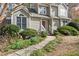 Inviting two-story home showcasing a walkway, well-manicured landscaping, and an appealing exterior with a red front door at 978 W Mill Bnd, Kennesaw, GA 30152
