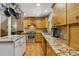 Spacious kitchen with granite countertops, stainless appliances, and hardwood floors at 978 W Mill Bnd, Kennesaw, GA 30152