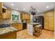 Spacious kitchen with granite countertops, stainless appliances, and hardwood floors at 978 W Mill Bnd, Kennesaw, GA 30152