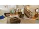 Cozy living room featuring a fireplace, staircase access, and neutral tones, creating a welcoming atmosphere at 978 W Mill Bnd, Kennesaw, GA 30152