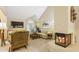 Cozy living room featuring a fireplace, vaulted ceilings, and comfortable seating at 978 W Mill Bnd, Kennesaw, GA 30152