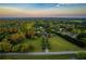 Breathtaking aerial view of a sprawling estate surrounded by lush greenery and mature trees at 3700 Tom Brewer Rd, Loganville, GA 30052