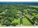 Expansive aerial view of the wooded estate with a long driveway leading to the home at 3700 Tom Brewer Rd, Loganville, GA 30052