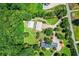 Aerial view showcasing the home and two large storage buildings with circular driveway at 3700 Tom Brewer Rd, Loganville, GA 30052