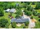 Beautiful aerial view of home with outbuildings and well-maintained grounds at 3700 Tom Brewer Rd, Loganville, GA 30052