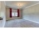 Bedroom with carpet, a chandelier, and a window with red curtains at 3700 Tom Brewer Rd, Loganville, GA 30052