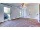 Bedroom with large windows and a double-door closet at 3700 Tom Brewer Rd, Loganville, GA 30052