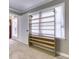 Bedroom with built-in shoe shelving with carpet flooring and neutral paint at 3700 Tom Brewer Rd, Loganville, GA 30052