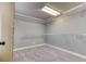 Spacious walk-in closet with wire shelving, carpeted flooring and neutral paint at 3700 Tom Brewer Rd, Loganville, GA 30052