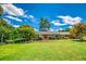 Charming brick home with a large front yard, lush landscaping, and inviting curb appeal at 3700 Tom Brewer Rd, Loganville, GA 30052