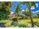 Exterior shot of home with fenced backyard, mature trees, and beautiful green lawn at 3700 Tom Brewer Rd, Loganville, GA 30052