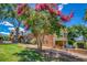 Beautiful exterior of a brick home with a lush green lawn and blooming crepe myrtle trees at 3700 Tom Brewer Rd, Loganville, GA 30052