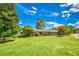 Brick home featuring landscaped grounds, a circular driveway, and classic architectural details at 3700 Tom Brewer Rd, Loganville, GA 30052