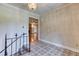 Foyer featuring decorative floors and stairs at 3700 Tom Brewer Rd, Loganville, GA 30052