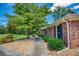 Charming brick home featuring manicured landscaping and a inviting walkway with stone edging at 3700 Tom Brewer Rd, Loganville, GA 30052