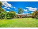Traditional brick home featuring a well-maintained lawn and classic shutters at 3700 Tom Brewer Rd, Loganville, GA 30052