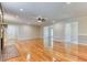 Spacious living room with gleaming hardwood floors and a ceiling fan at 3700 Tom Brewer Rd, Loganville, GA 30052
