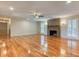 Expansive living area with gleaming hardwood floors, fireplace, and natural light at 3700 Tom Brewer Rd, Loganville, GA 30052