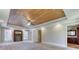 Spacious main bedroom features a trey ceiling, wood accents, and an ensuite bathroom at 3700 Tom Brewer Rd, Loganville, GA 30052