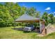 Covered parking featuring a metal roof with exposed beams, providing ample storage space at 3700 Tom Brewer Rd, Loganville, GA 30052