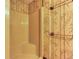 Shower with bamboo patterned wallpaper and towel racks at 3700 Tom Brewer Rd, Loganville, GA 30052