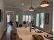 Bright, open concept kitchen/dining featuring modern appliances and elegant dining space at 507 Godfrey Dr, Cumming, GA 30040