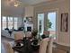 Elegant dining room featuring stylish table setting, modern decor, and plenty of natural light at 507 Godfrey Dr, Cumming, GA 30040