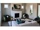 Comfortable living room featuring a fireplace with white brick, ample light, and plush seating at 507 Godfrey Dr, Cumming, GA 30040
