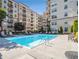 An inviting swimming pool surrounded by lounge chairs and lush landscaping for relaxation at 230 E Ponce De Leon Ave # 322, Decatur, GA 30030