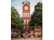 Historic brick Cumming City Hall with a clock tower at 503 Godfrey Dr, Cumming, GA 30040