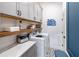 Bright laundry room with modern cabinets, shelving, and stylish flooring at 503 Godfrey Dr, Cumming, GA 30040